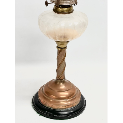 445 - An early 20th century oil lamp with copper and brass column. 60cm