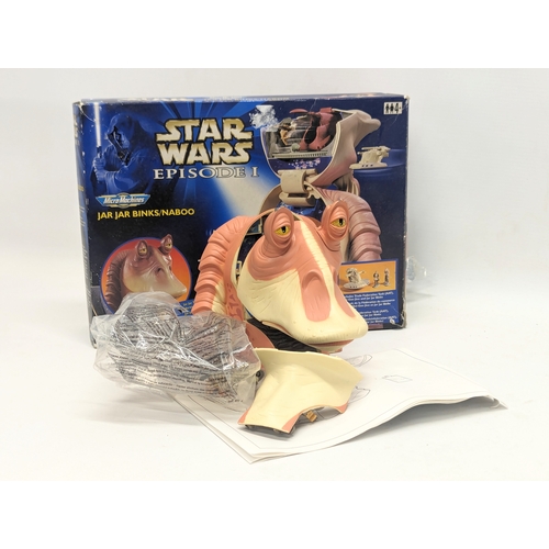 509 - A collection of 3 Star Wars models including a talking Stormtrooper, Star Wars Episode I Jar Jar Bin... 