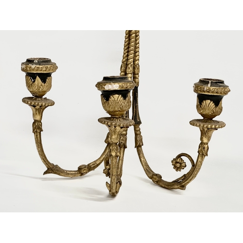 105 - A pair of 19th century gilt 3 branch wall sconces. 27x42cm