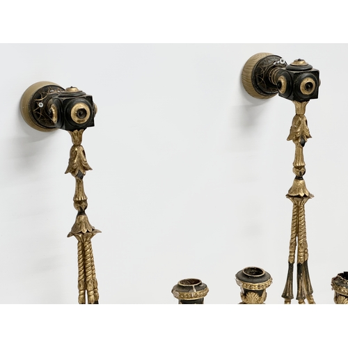 105 - A pair of 19th century gilt 3 branch wall sconces. 27x42cm