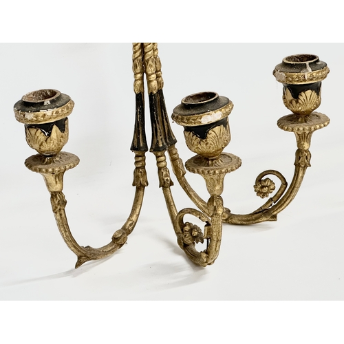 105 - A pair of 19th century gilt 3 branch wall sconces. 27x42cm