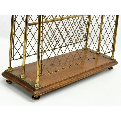 265 - A late Victorian brass and mahogany paper rack/magazine rack. 36x15x37cm