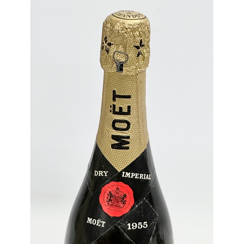 448 - A bottle of Moet & Chandon Dry Imperial champagne. 1955. Finest Extra Quality. Epernay, France.