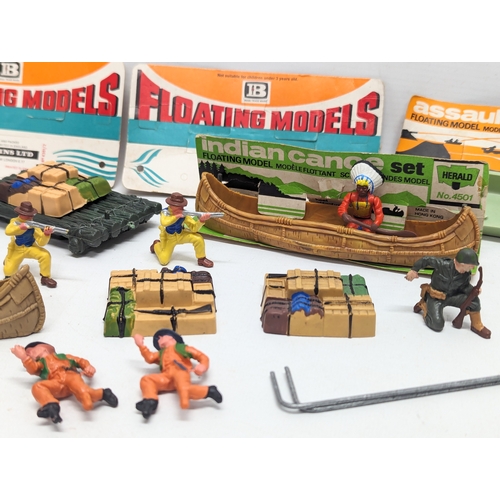 523 - A collection of vintage Britains Herald Floating models, cowboys and Indians.