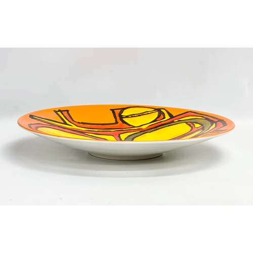 361 - A large Poole Pottery ‘Delphis’ charger/bowl designed by Carol Cutler. 41x6cm