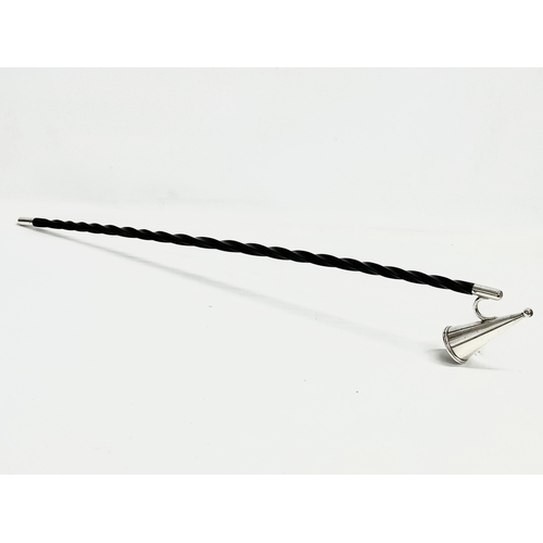 469 - A Victorian silver plated Baleen candle snuffer. 71cm