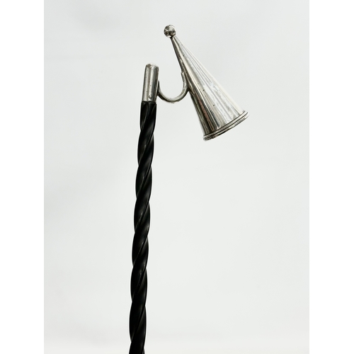 469 - A Victorian silver plated Baleen candle snuffer. 71cm