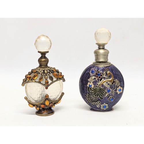 472 - A collection of ornate scent bottles / perfume bottles.