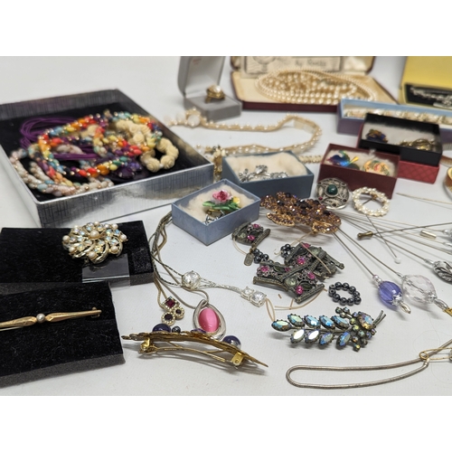 601 - A collection of vintage costume jewellery including watches, necklaces, brooches, etc.