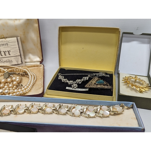 601 - A collection of vintage costume jewellery including watches, necklaces, brooches, etc.