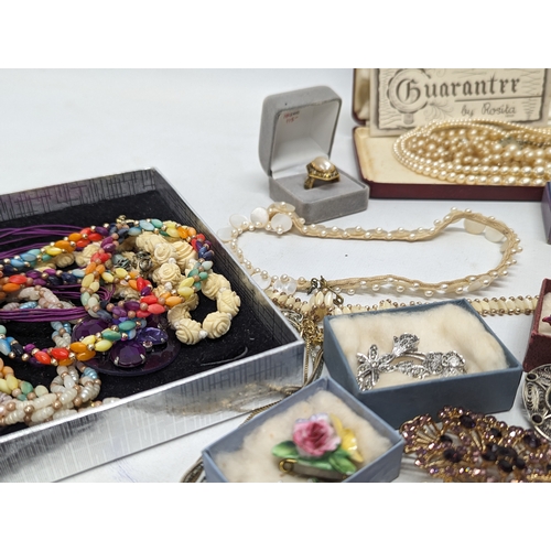 601 - A collection of vintage costume jewellery including watches, necklaces, brooches, etc.