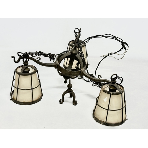 127 - An early 20th century Arts & Crafts Wrought Iron chandelier.