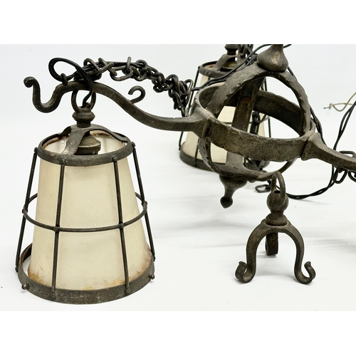 127 - An early 20th century Arts & Crafts Wrought Iron chandelier.