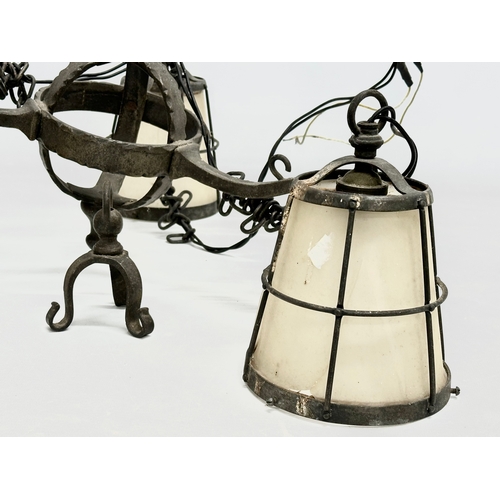 127 - An early 20th century Arts & Crafts Wrought Iron chandelier.