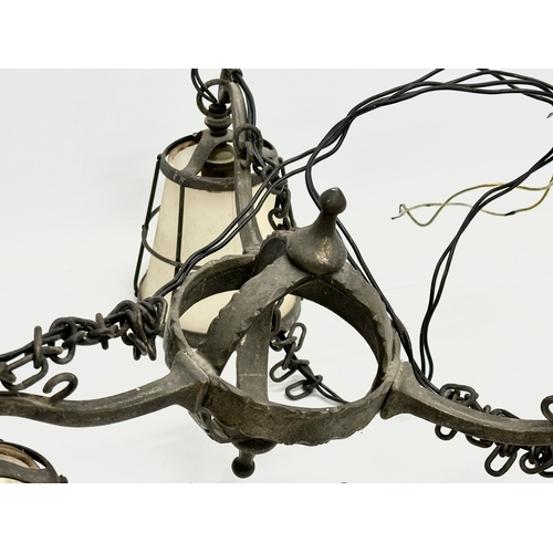 127 - An early 20th century Arts & Crafts Wrought Iron chandelier.