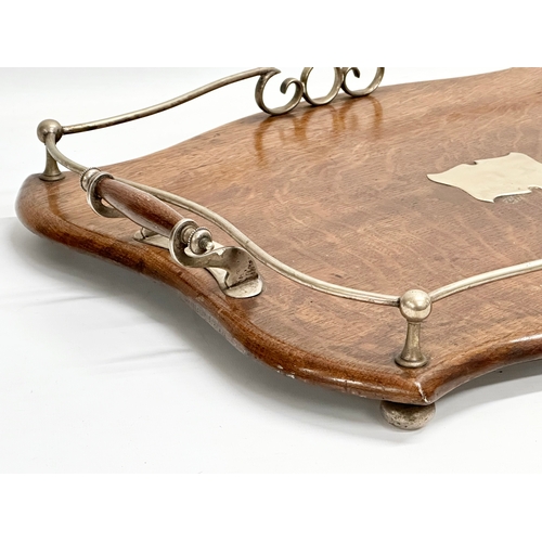 277 - An early 20th century oak and silver plated serving tray. 52x39x8cm