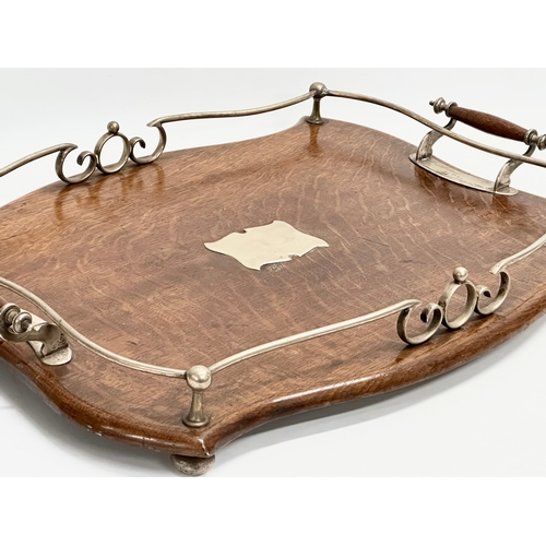 277 - An early 20th century oak and silver plated serving tray. 52x39x8cm