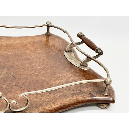 277 - An early 20th century oak and silver plated serving tray. 52x39x8cm