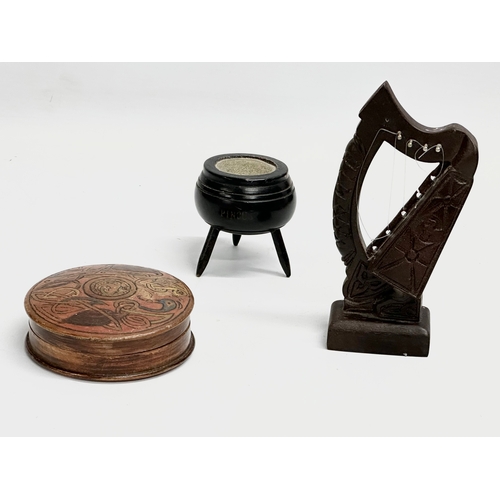 477 - 3 pieces of Irish Collectables. An early 20th century wooden treen and cover 9x3.5cm. An Irish turf ... 