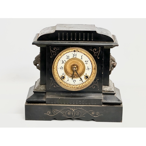 479 - A late 19th century American slate, marble and brass mantle clock. Ansonia Clock Co. With key and pe... 