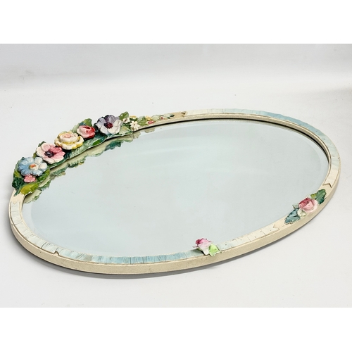 281 - A vintage Barbola wall mirror. 56x49cm W