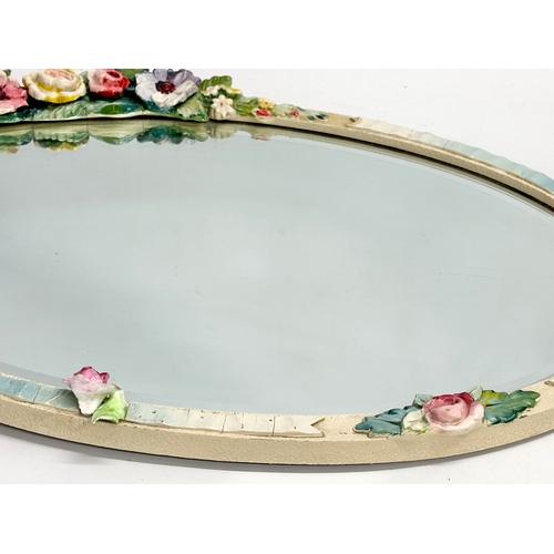 281 - A vintage Barbola wall mirror. 56x49cm W