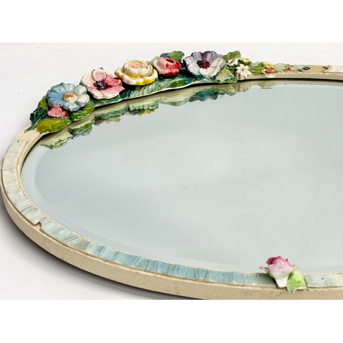 281 - A vintage Barbola wall mirror. 56x49cm W