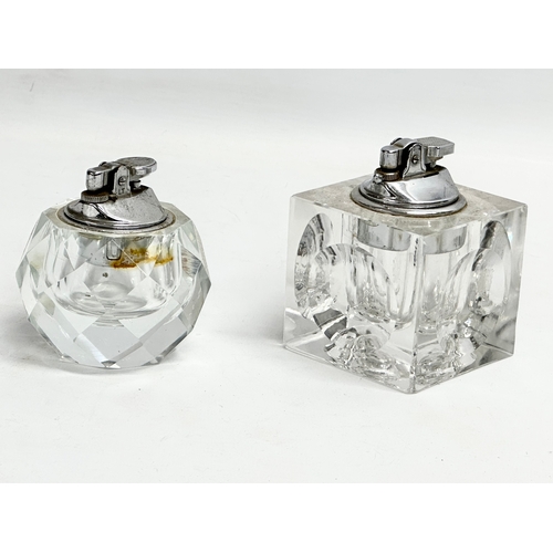 482 - 2 vintage heavy cut glass table lighters. 7x7x9.5cm