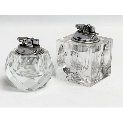 482 - 2 vintage heavy cut glass table lighters. 7x7x9.5cm