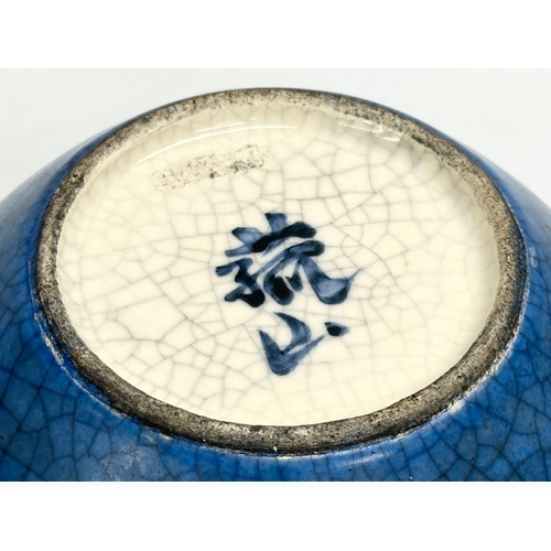 484 - A 20th century Chinese blue Crackle Glazed 3 handled ring pot. Impressed mark on rear. 17x18cm