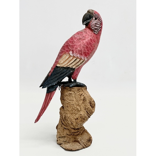 488 - A good quality vintage hand painted parrot on wooden base. 27.5cm