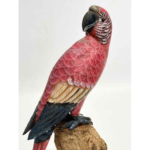 488 - A good quality vintage hand painted parrot on wooden base. 27.5cm