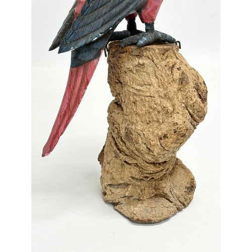 488 - A good quality vintage hand painted parrot on wooden base. 27.5cm