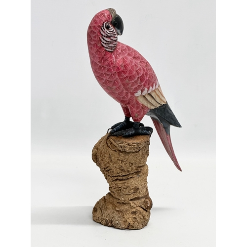 488 - A good quality vintage hand painted parrot on wooden base. 27.5cm