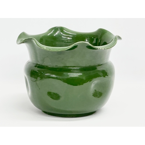 489 - An early 20th century English green glazed pottery jardiniere with frilled. Circa 1890-1910. 27.5x21... 