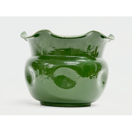 489 - An early 20th century English green glazed pottery jardiniere with frilled. Circa 1890-1910. 27.5x21... 