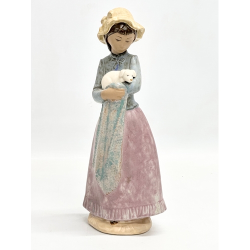 659 - 3 Spanish pottery figurines. Lladro, NAO, Nadal. A Lladro ‘Girl with Turkey’ 13x15cm. A NAO ‘Girl wi... 