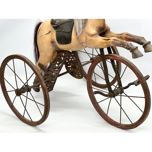 405 - A Victorian style child’s Velocipede/horse tricycle. 86x61x80cm