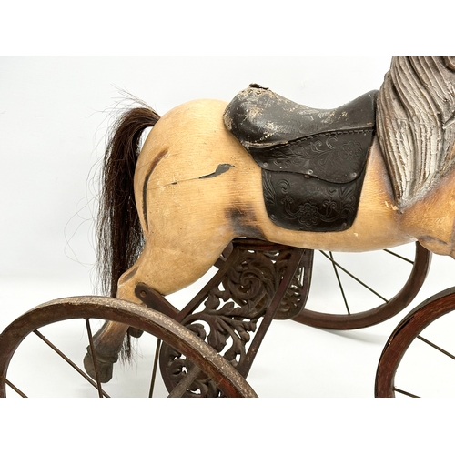 405 - A Victorian style child’s Velocipede/horse tricycle. 86x61x80cm