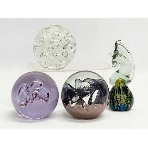 494 - 4 large Art Glass paperweights. Including an Mdina ‘Seahorse’ paperweight.