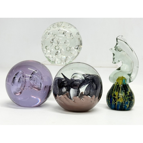 494 - 4 large Art Glass paperweights. Including an Mdina ‘Seahorse’ paperweight.