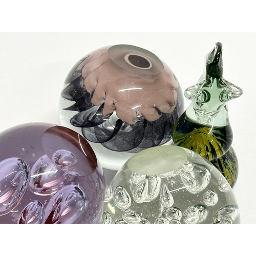 494 - 4 large Art Glass paperweights. Including an Mdina ‘Seahorse’ paperweight.