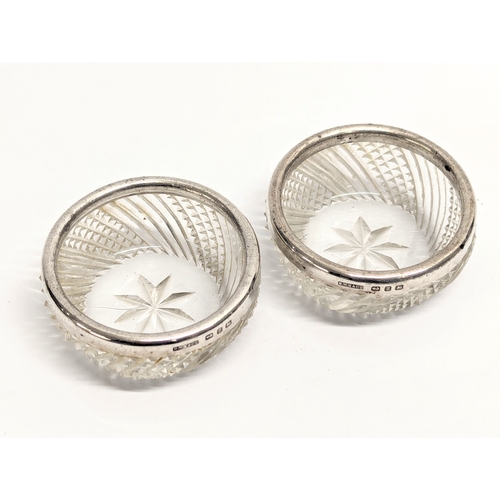 557 - A pair of late 19th century cut glass salts with silver rims by G. W. Harvey & Co. Birmingham, 1899.