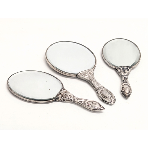 559 - A set of 3 ornate silver vanity mirrors. Turkish, 1923-1939. Largest measures 17.5cm