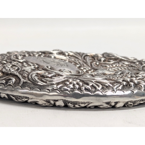 560 - A late 19th century ornate silver vanity mirror by Joseph Gloster. Birmingham, 1897. 25.5cm