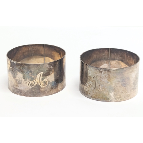 563 - A pair of silver napkin rings by Wakely & Wheeler. London, 1945. 51.79g