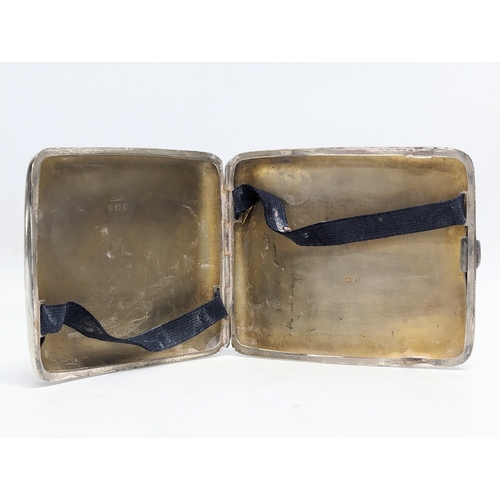 569 - An early 20th century silver cigarette case by Henry Williamson Ltd. Birmingham, 1915. 114g. 10x8.5c... 