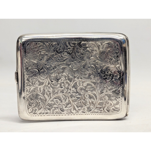 569 - An early 20th century silver cigarette case by Henry Williamson Ltd. Birmingham, 1915. 114g. 10x8.5c... 