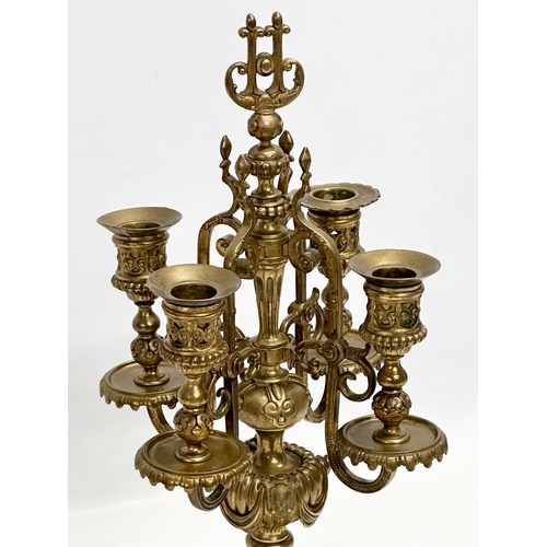 16 - A pair of good quality early 20th century brass candelabrums with pierced bases and draped urn style... 