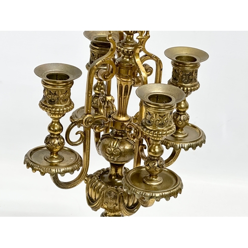 16 - A pair of good quality early 20th century brass candelabrums with pierced bases and draped urn style... 